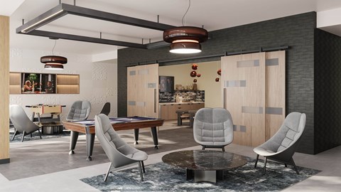 A modern living room with a grey chair and a black and white rug.