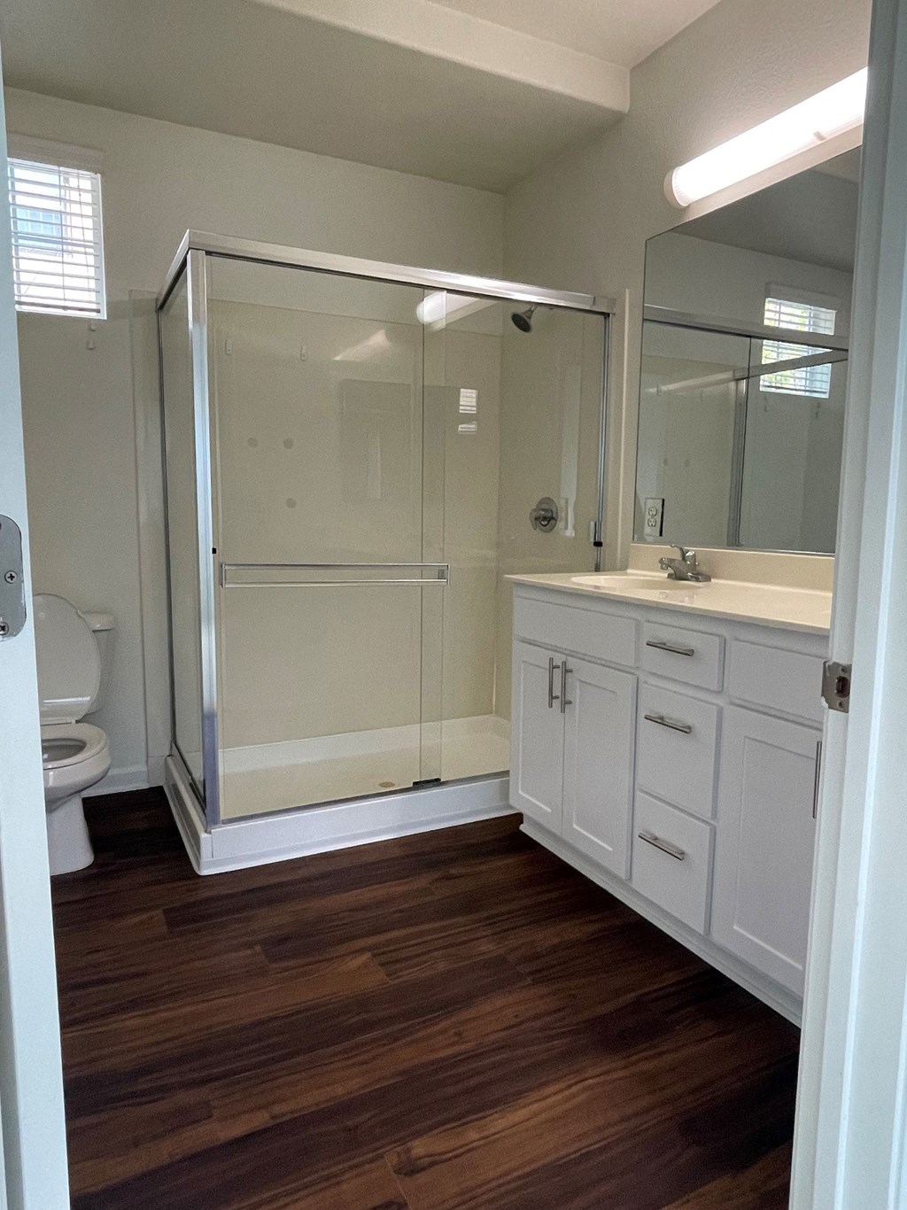 a bathroom with a sink toilet and a shower