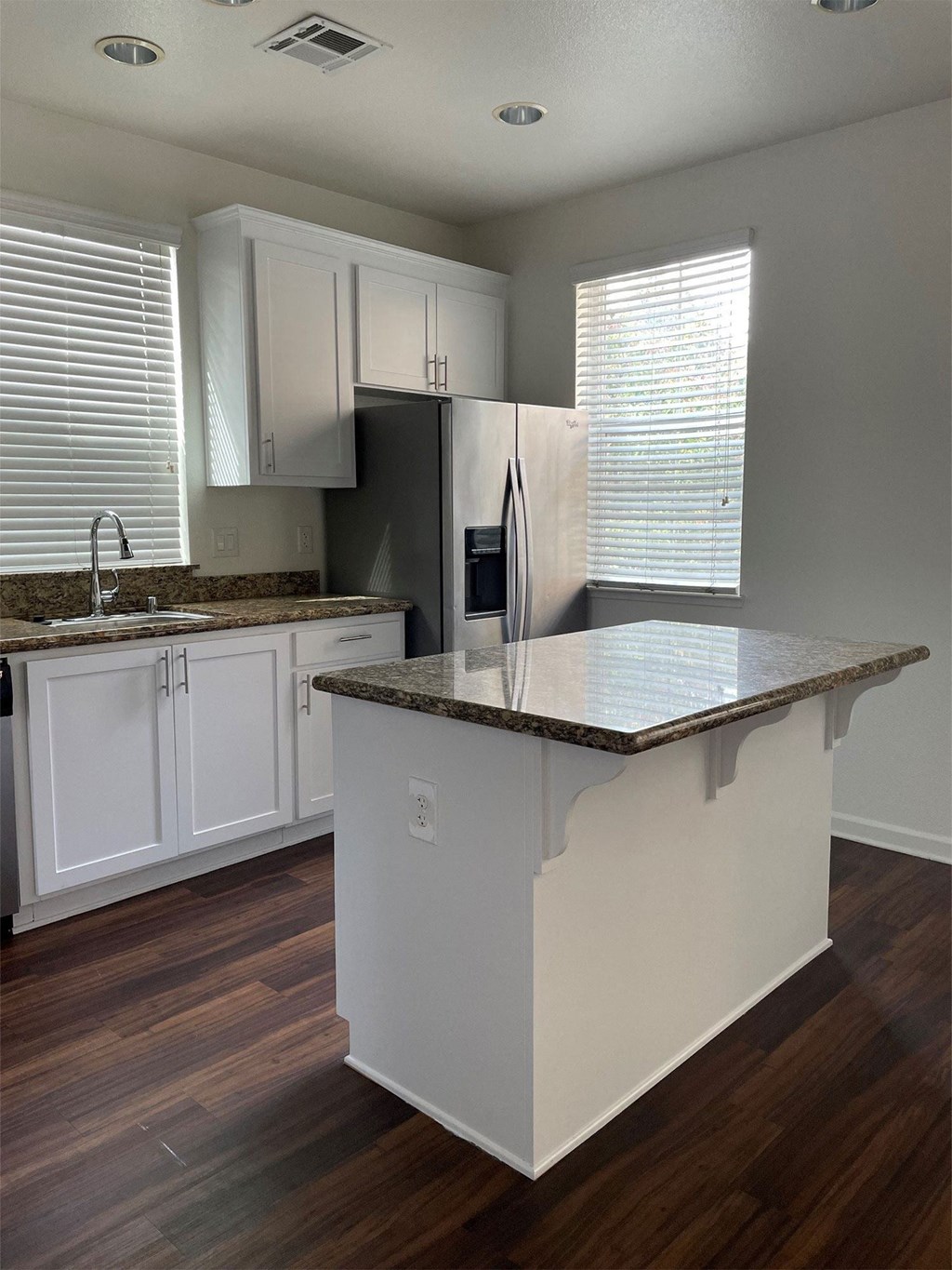 renovated kitchen with updated white cabinets