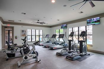 Gym with treadmills and other exercise equipment at Silverado, Frisco