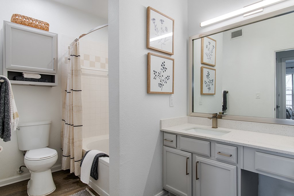 a bathroom with a toilet sink and bathtub