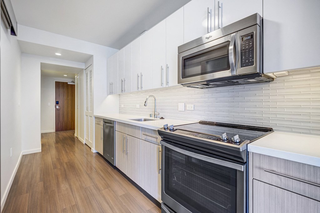 stainless steel appliances with open kitchen