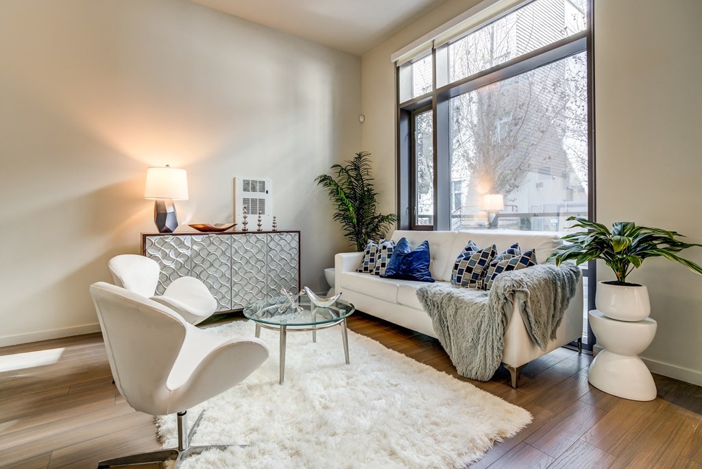 Transbay San Francisco Apartments for Rent - Solaire - Floor-to-Ceiling Windows, White Couch, Hardwood Floors, and Glass Table