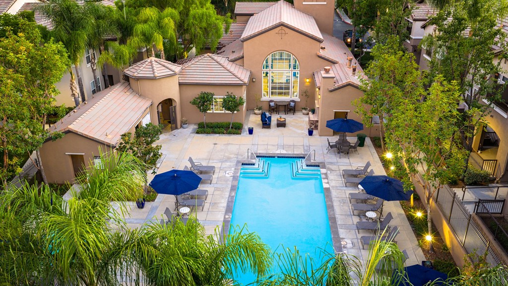 A large house with a pool in the backyard.