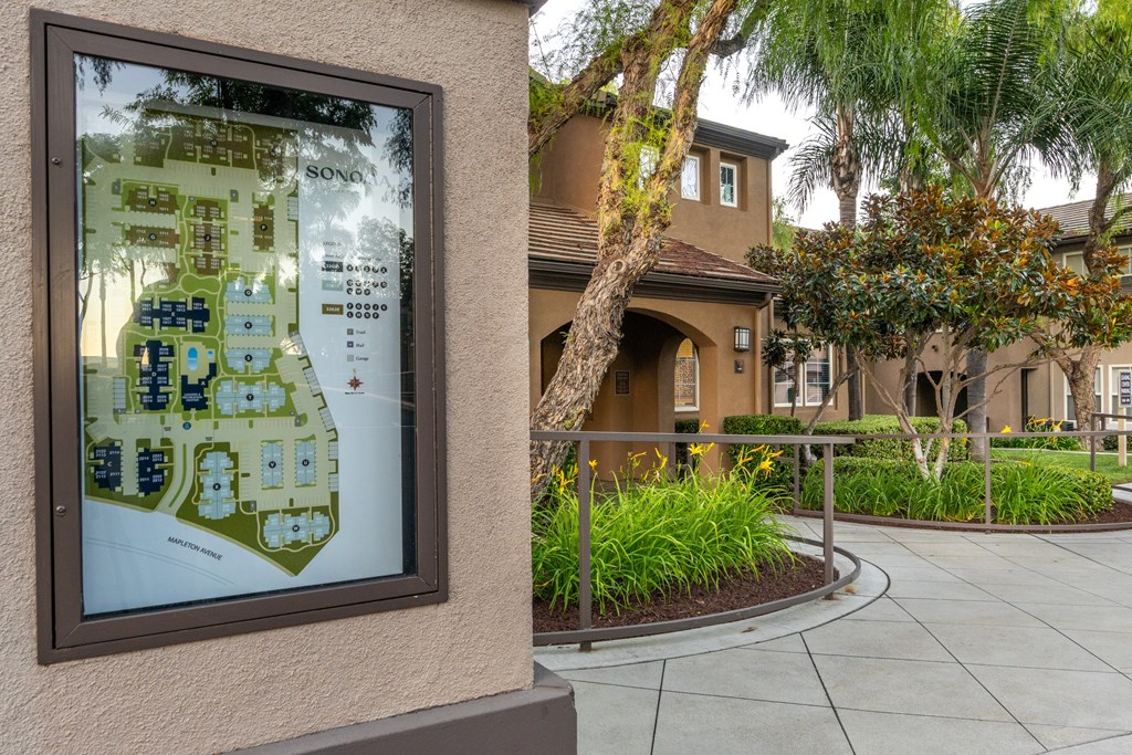 A map of a Sony housing development is displayed on a wall.