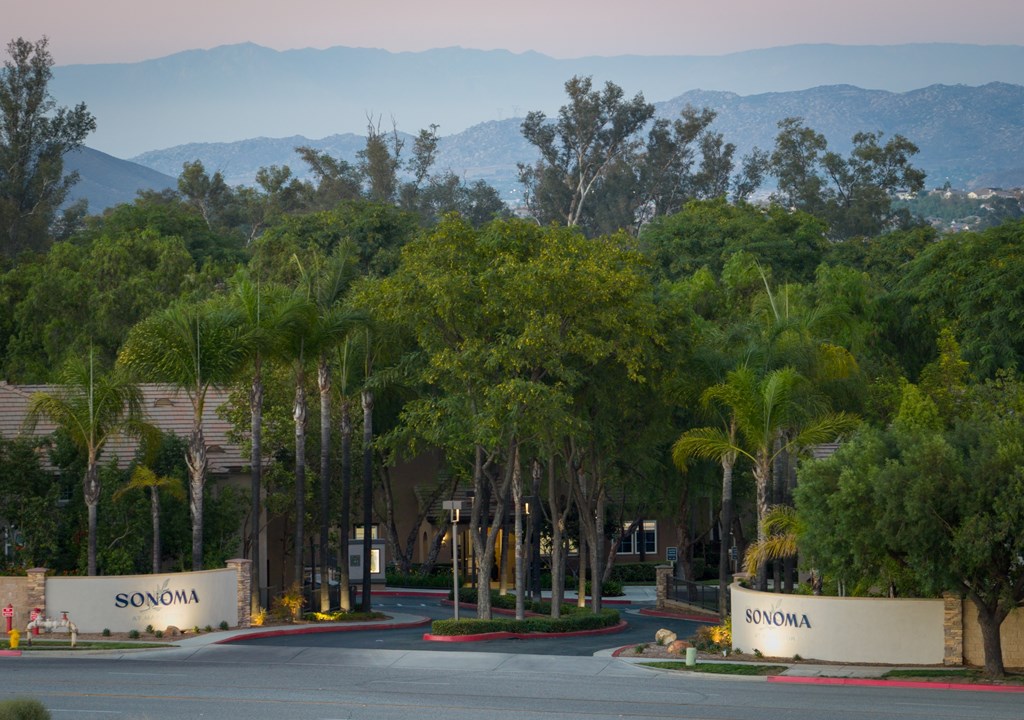 The image shows a beautiful Sonoma sign in front of a tree-lined street.