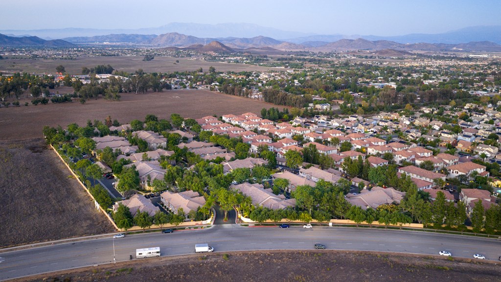 A residential area with houses and a road.