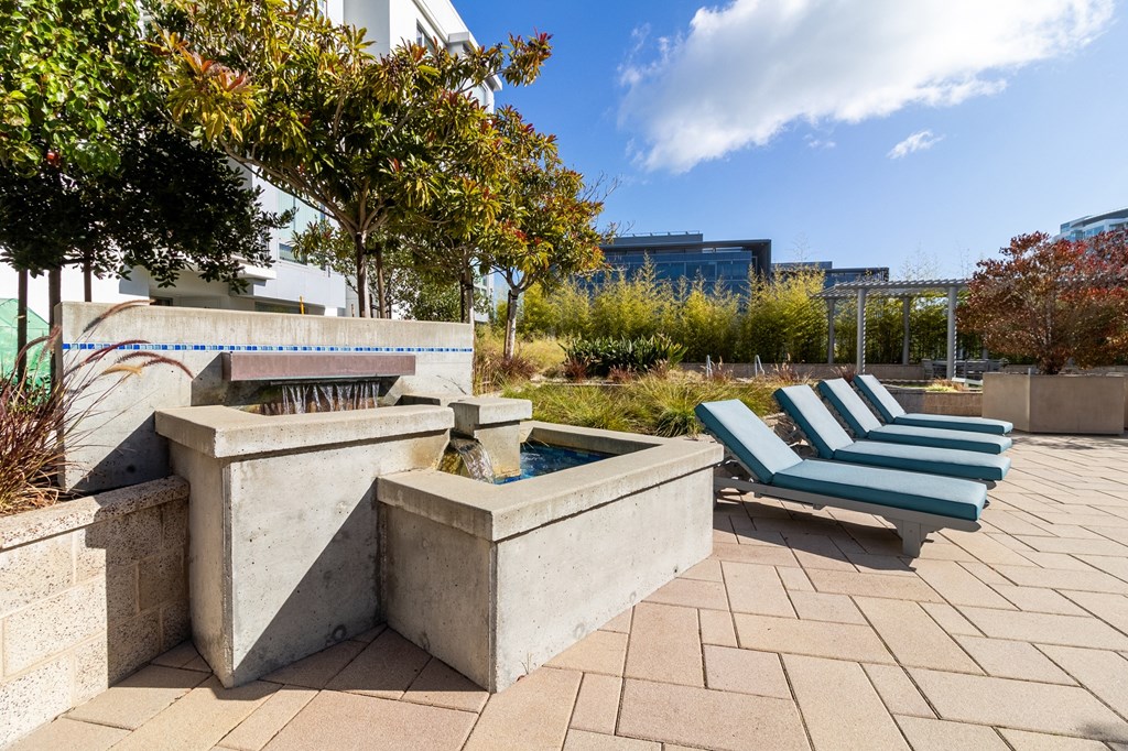 patio lounge chairs and fountain