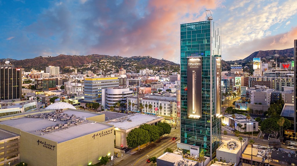 a city skyline at dusk with Sunset Vine Towers