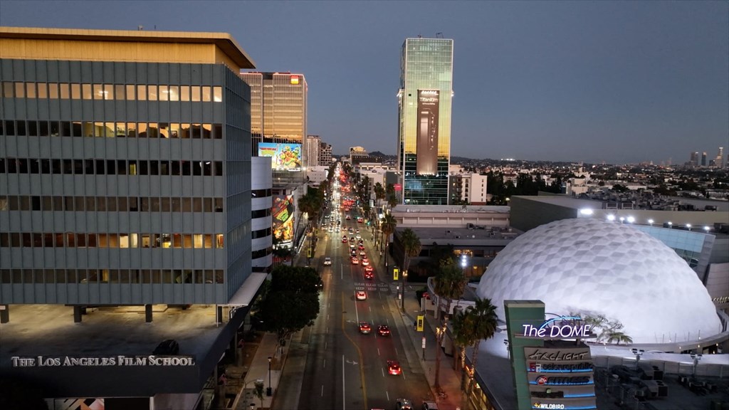 city at night with The Dome and Sunset Vine Towers in the background