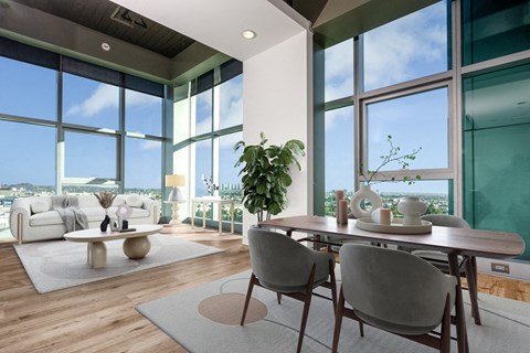 A modern dining room with a table set for two and a view of the city.