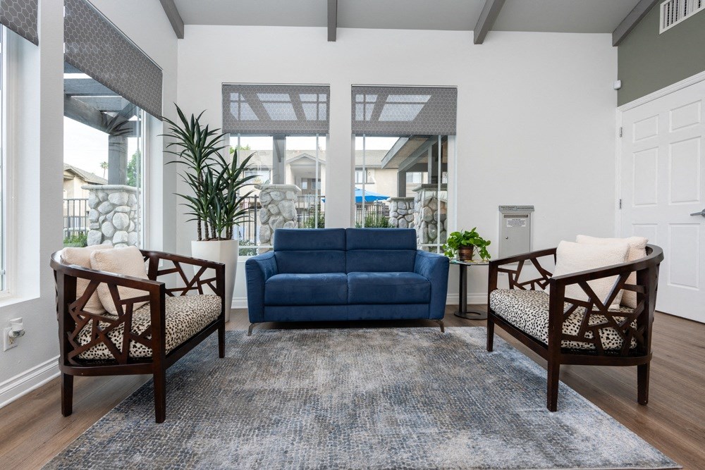 Leasing office with blue couch at Sunstone Place, California, 92505