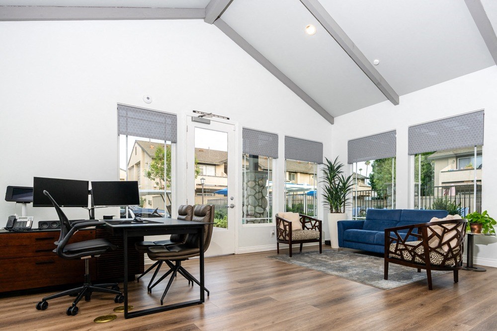 leasing office with a desk with a computer and a couch at Sunstone Place, Riverside, California
