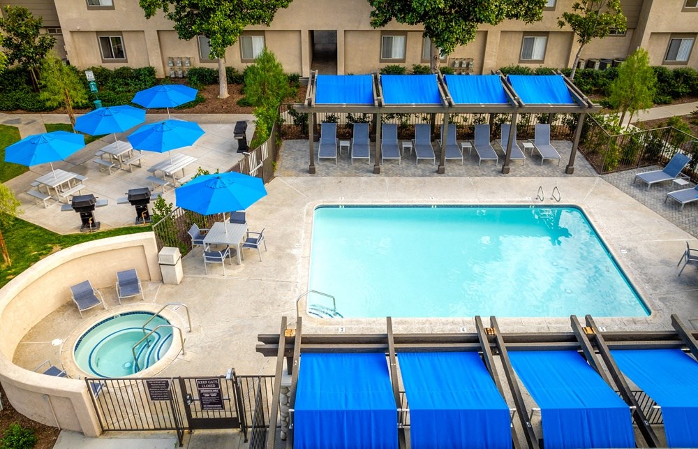 Aerial view of the swimming pool and lounge seating at Sunstone Place, Riverside, CA, 92505