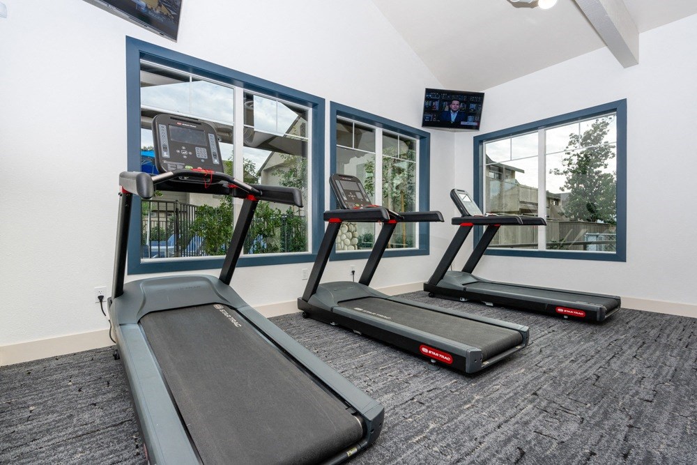 treadmills in front of a window in a gym at Sunstone Place, Riverside, CA