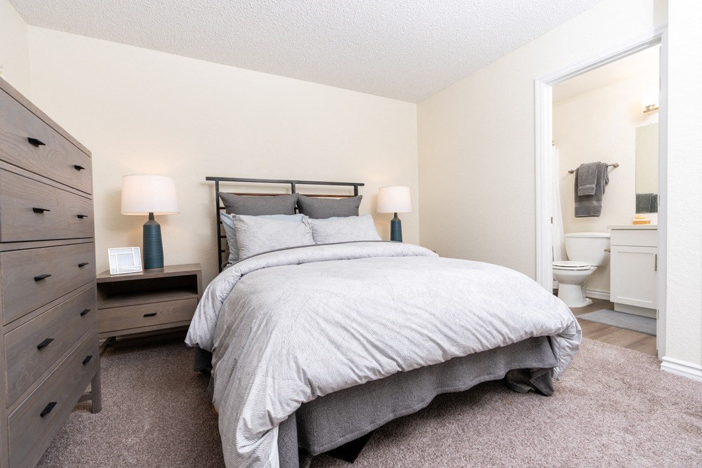 a bedroom with a bed and a bathroom at Sunstone Place, Riverside, CA, 92505