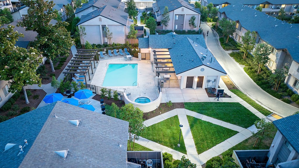 a birdseye view of a backyard with a swimming pool and a pool house at Sunstone Place, Riverside, CA