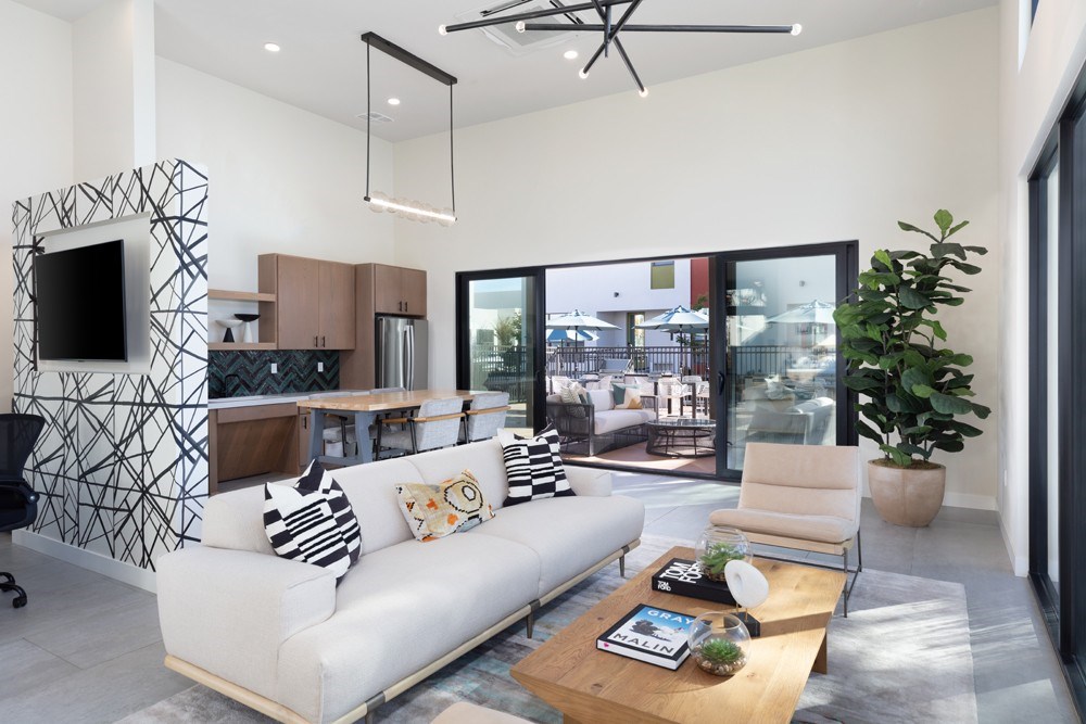 a living room with a white couch and a table