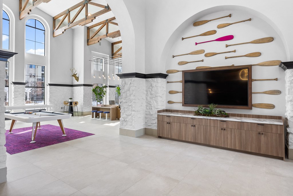a living room with a tv and a table at Terracina, Colorado 80020