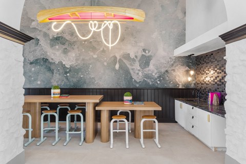 a dining room with a table and chairs and a mural on the wall at Terracina, Colorado 80020