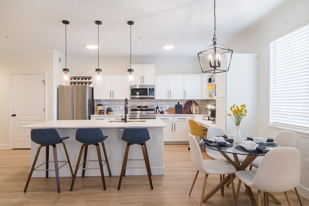 a kitchen and dining area with a table and chairs at Terracina, Broomfield, Colorado