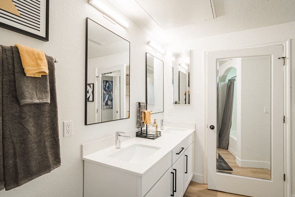 a bathroom with a sink and a mirror at Terracina, Colorado 80020