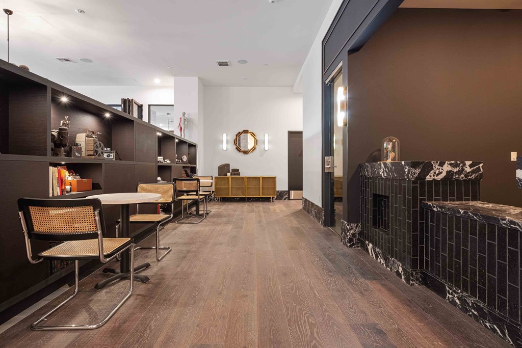 a dining room with tables and chairs and a fireplace