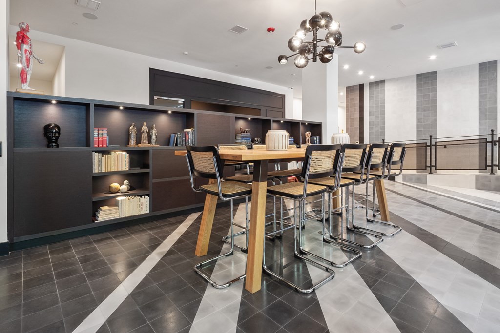 a dining room with a wooden table and chairs