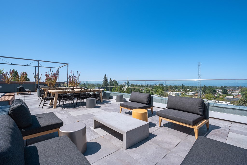 Studio Apartments in Berkeley, CA - The Addison - Rooftop Deck with Outdoor Lounge Furniture, Dining Tables and Chairs, and Unobstructed Views of the City.