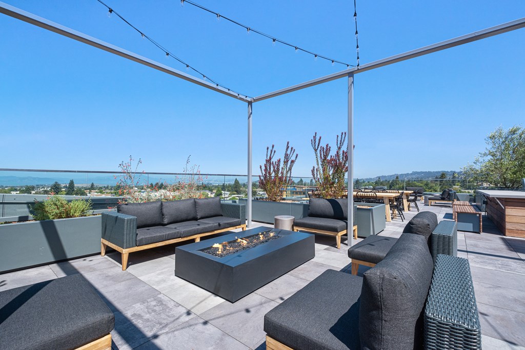 Dog-Friendly Apartments In Berkeley, CA - The Addison - Rooftop Patio With Outdoor Furniture, a Firepit, and Unobstructed Views of the City/Golden Gate Bridge