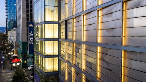 A modern building with a sign that reads The Alfred
