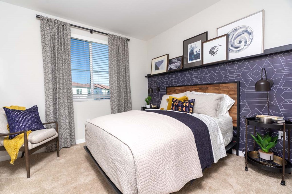 a bedroom with a bed and a window