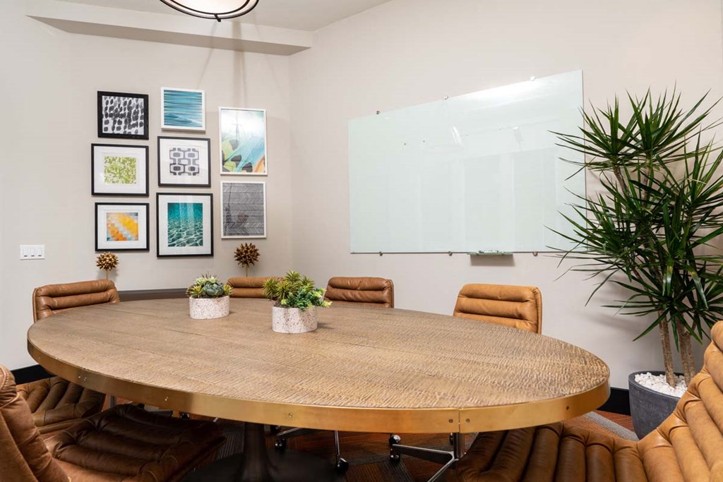a conference room with a large table and chairs
