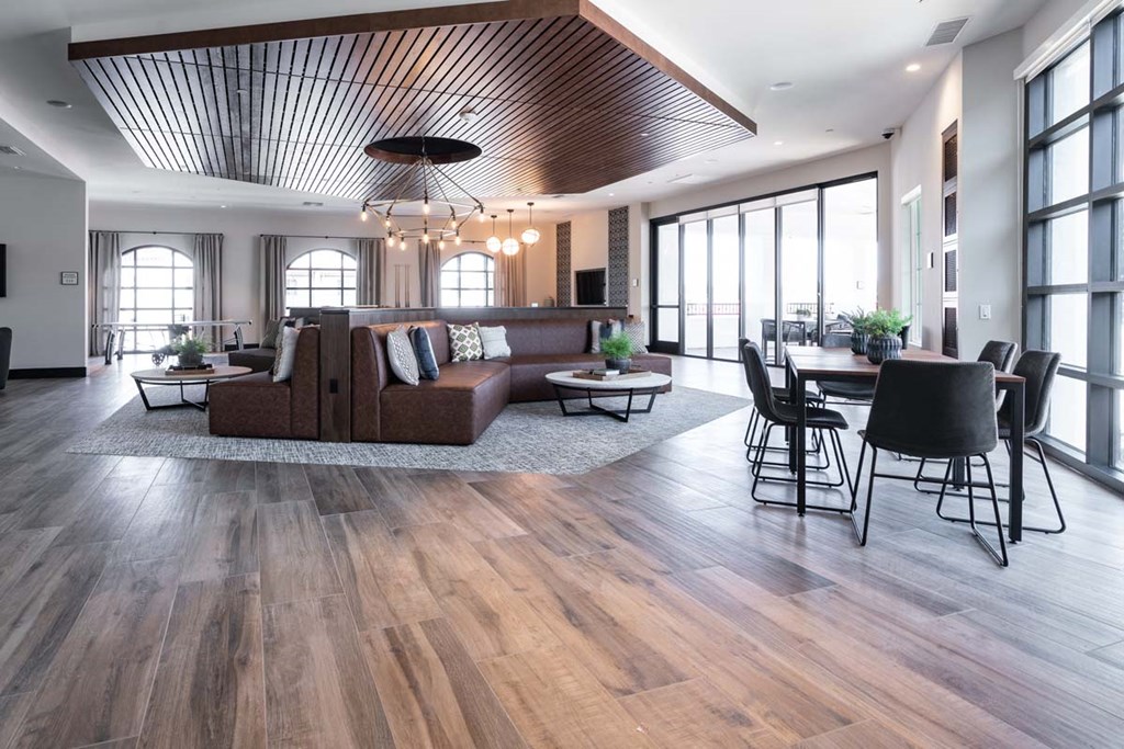 a living room with a couch and a table and chairs