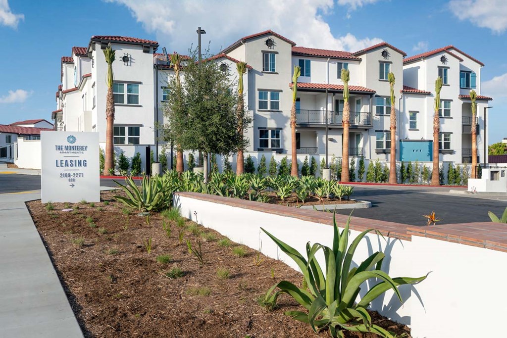 an image of an apartment building with a sign in front of it