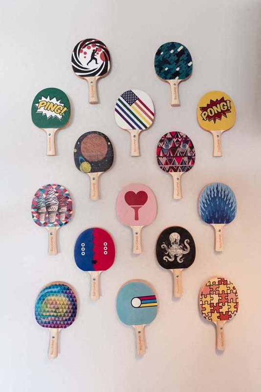 a clock made out of tennis rackets