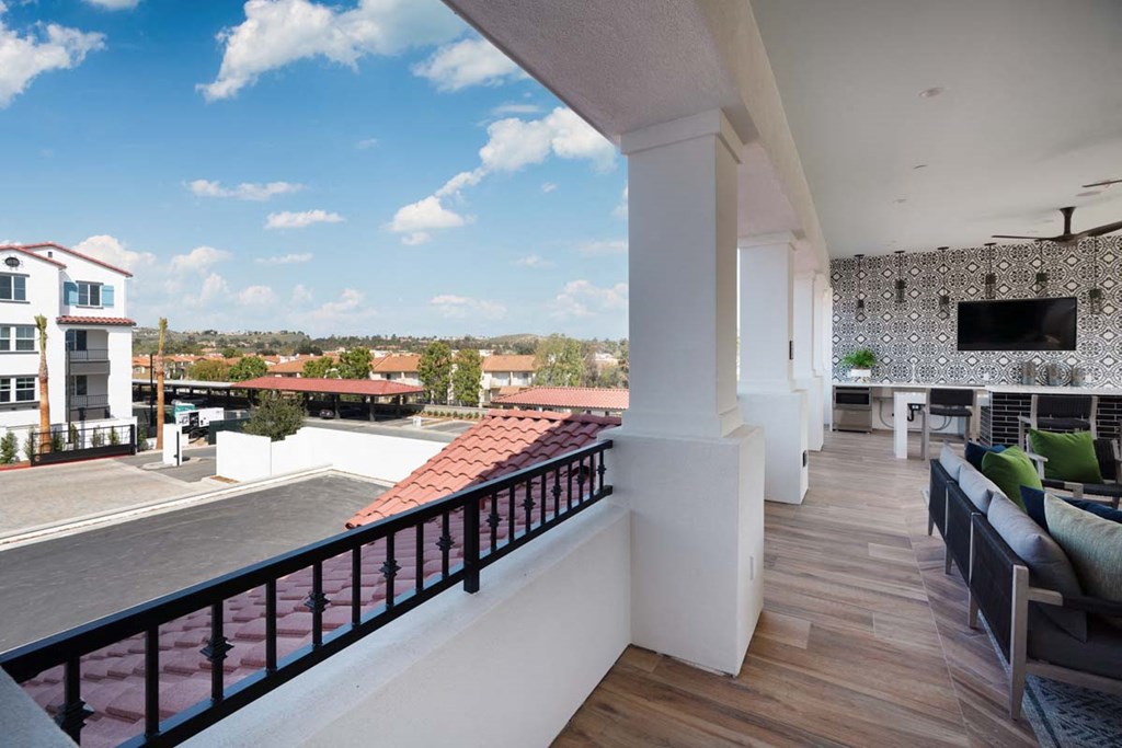 a balcony or terrace with a view of a city