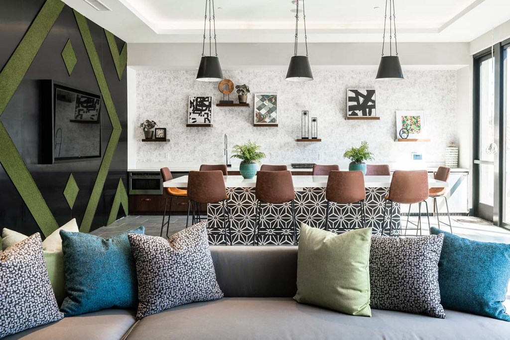 a living room with a couch and a table with chairs