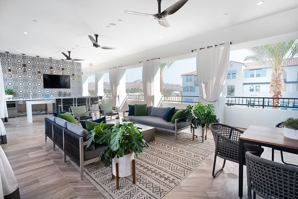 a living room with couches and chairs and a table