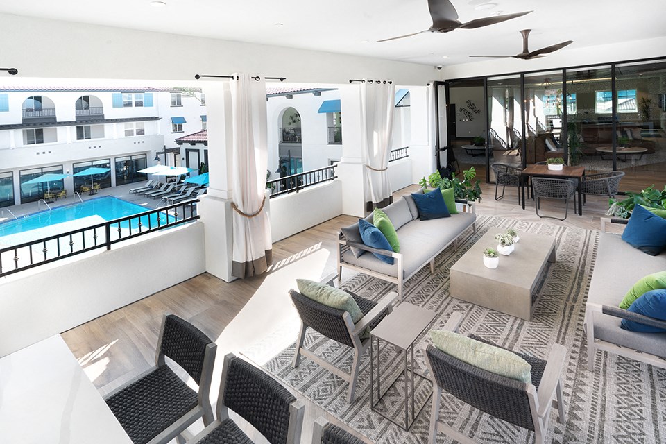 a rendering of a living room with furniture and a pool