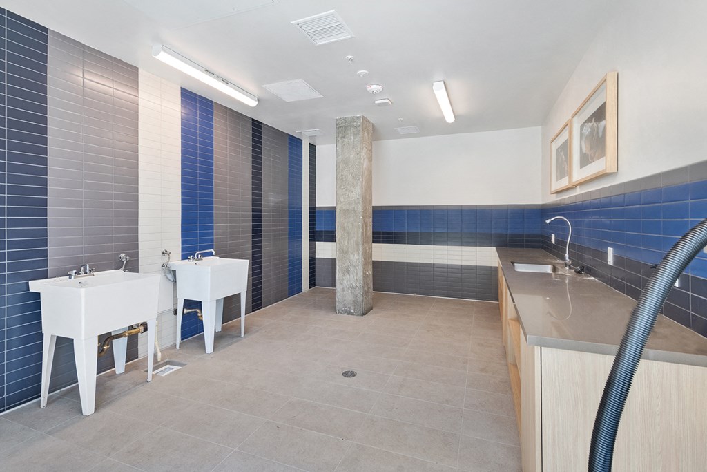 a public restroom with two sinks and two urinals