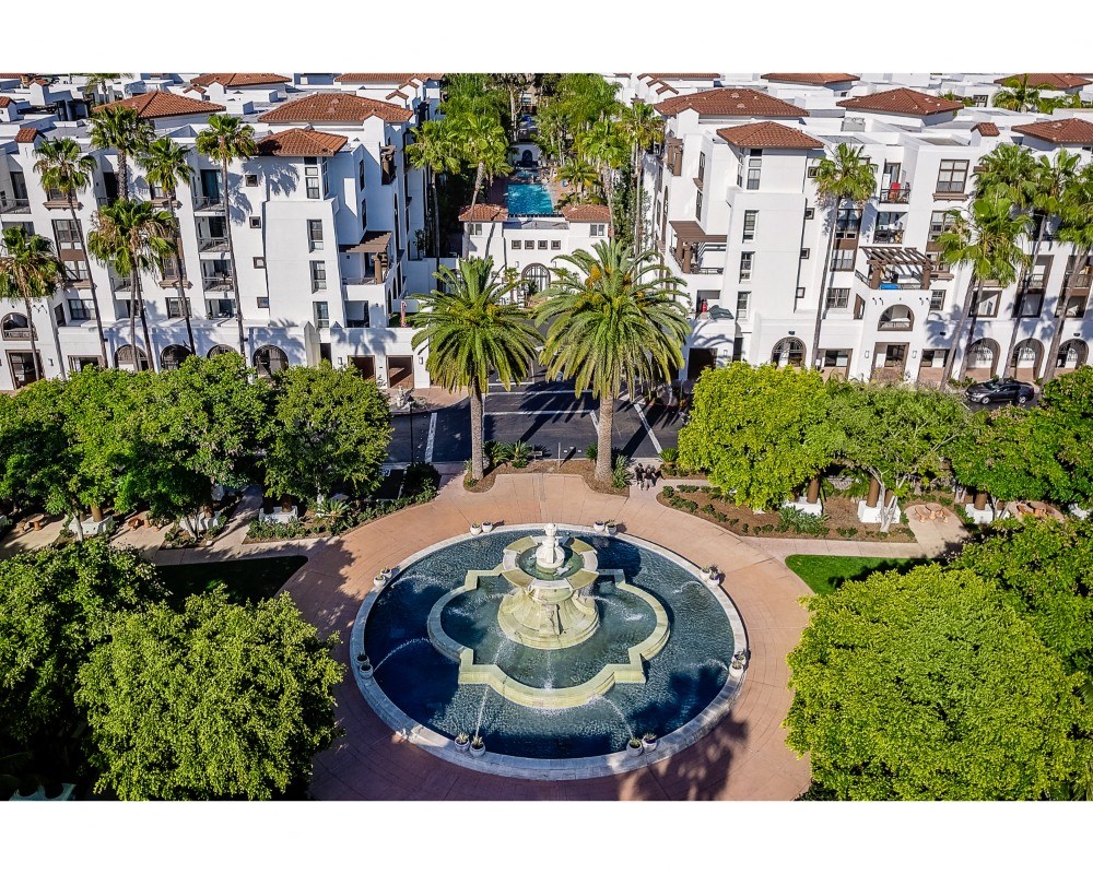 aerial view of promenade rio vista apartments and water fountain with lush landscaping at The Promenade Rio Vista, San Diego, California