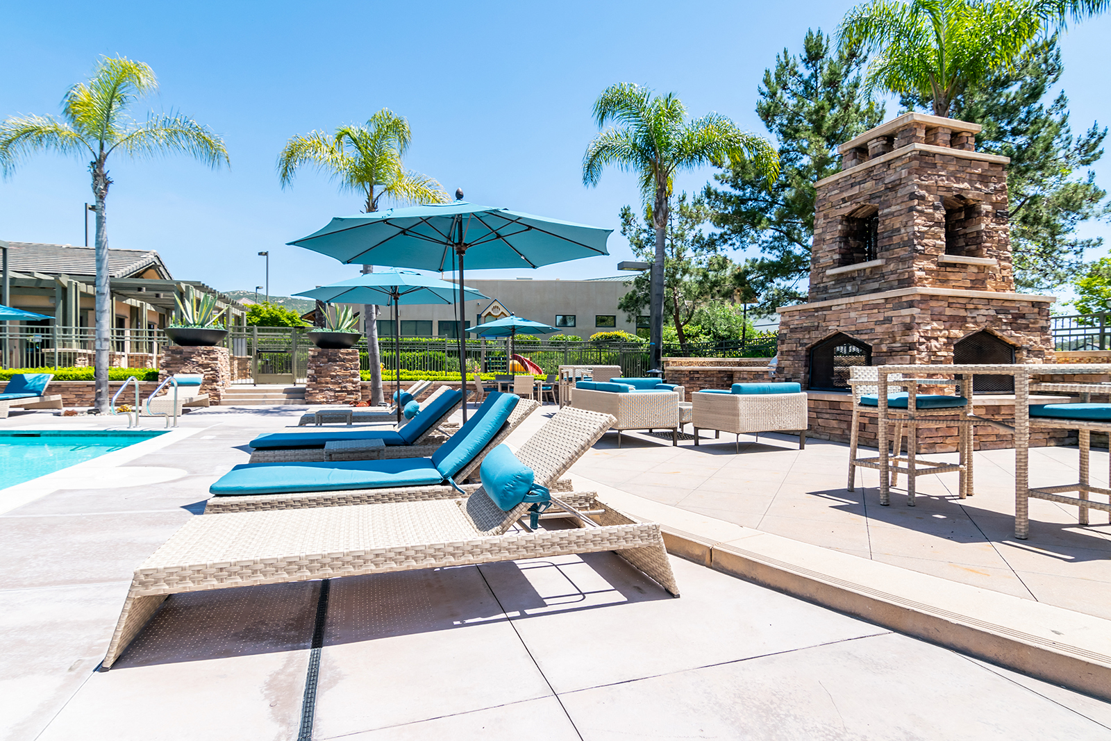 Outdoor pool area with lounge chairs