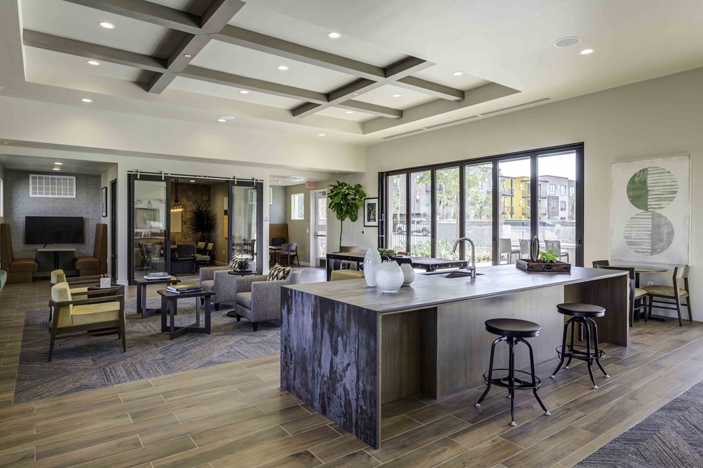 a large open concept living room with a kitchen and dining area