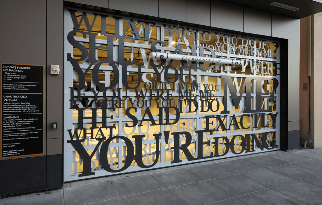 a mural on the side of a building with words on it