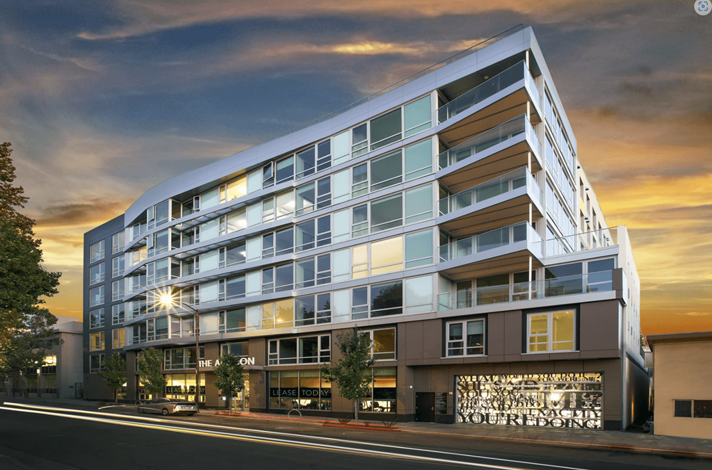 a rendering of an apartment building on a city street