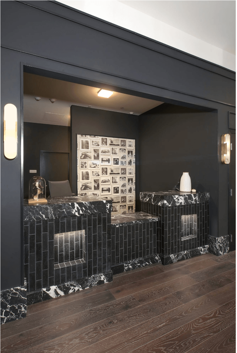 a room with two beds and a mirror in it