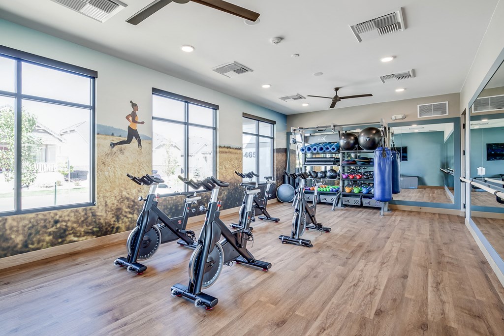 resident fitness center with cycling bike and weights