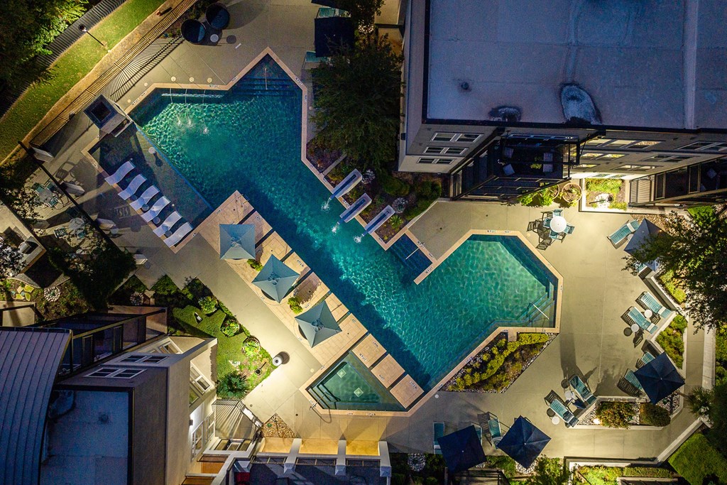 arial view of a resort pool at night at Trend Design District, Dallas, TX 75207