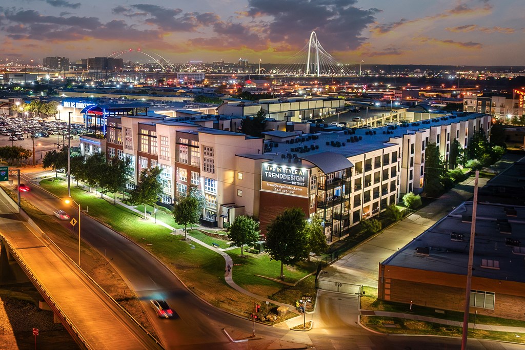 an aerial view of apartment with cityscape in background at Trend Design District, Dallas, TX